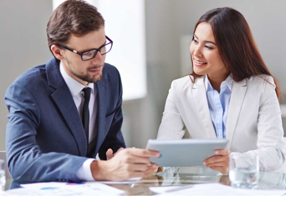 Marketing professionals discussing Invisalign sales strategies during a consultation.