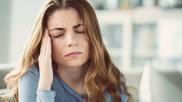 women struggling with headache